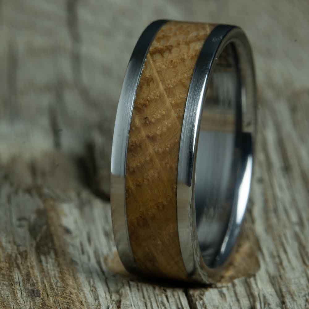 Wedding ring with Whiskey barrel wood and polished titanium