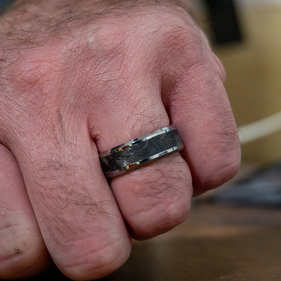 tungsten forged carbon fiber ring on finger 