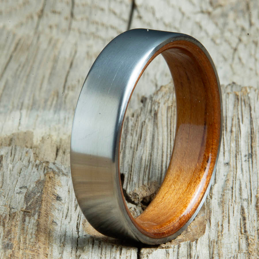 classic satin titanium with Hawaiian Koa wood interior ring. Custom titanium wood rings made by Peacefield Titanium