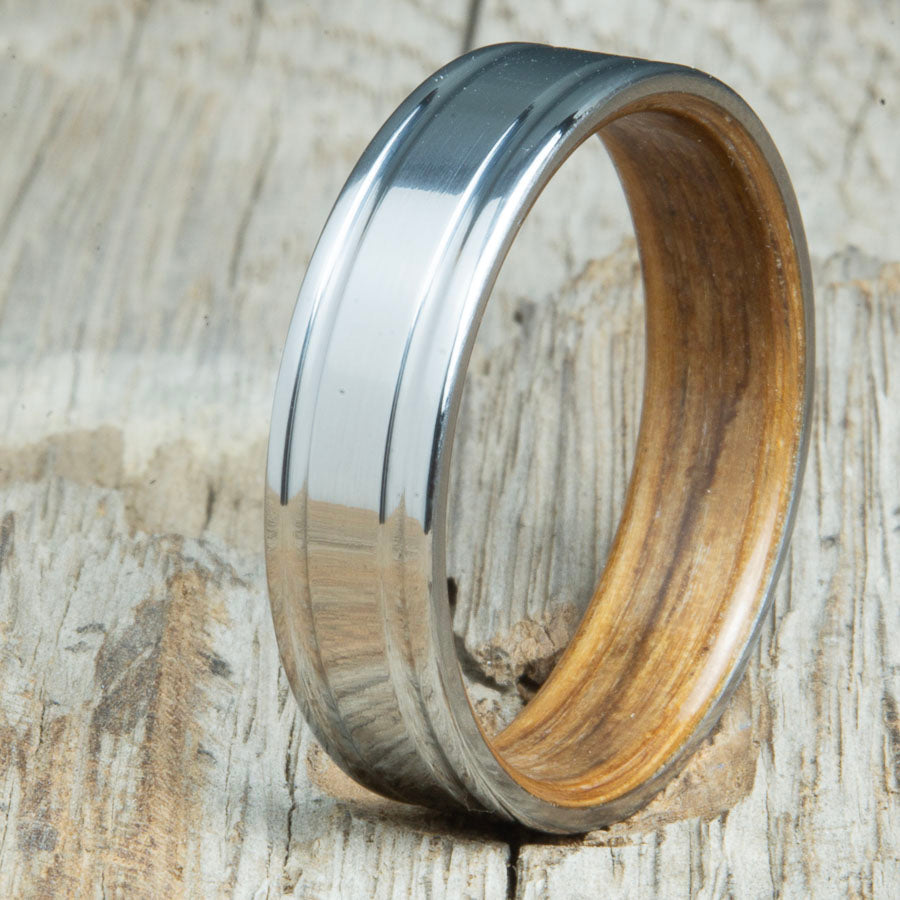 Titanium wedding band with Whiskey barrel interior