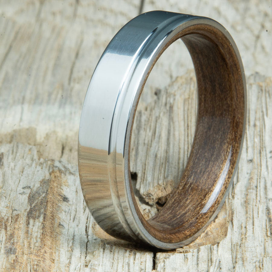 Titanium wedding bands with Walnut interior. Unique handcrafted rings and bands made by Peacefield Titanium.